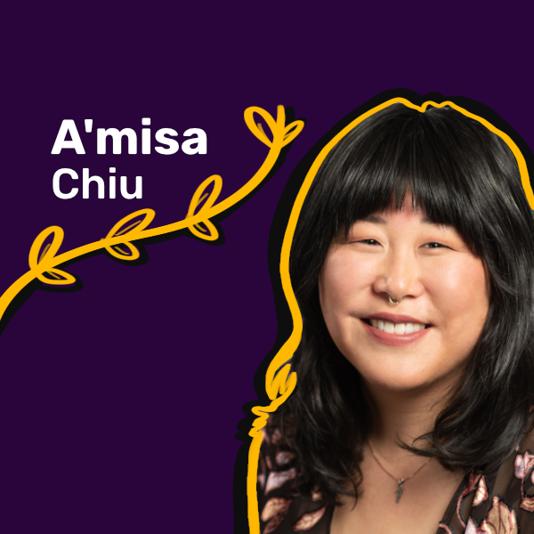 A smiling Asian American woman with bangs and choppy shoulder length hair