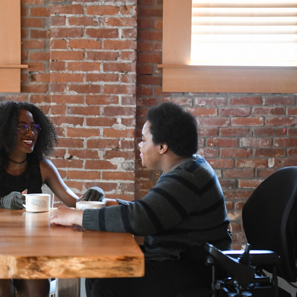 Coffee date with power wheelchair in view